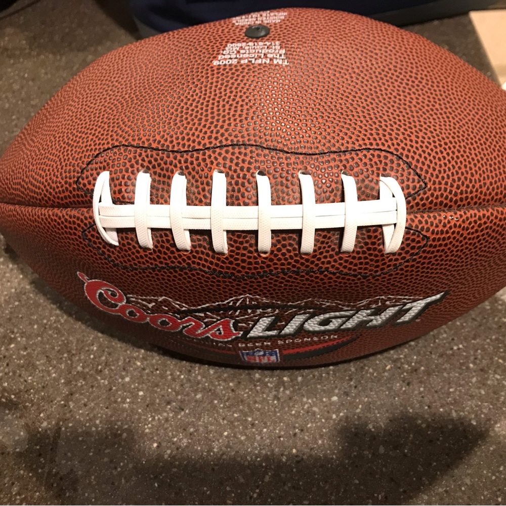 Nfl football regular size never been pumped up or thrown.